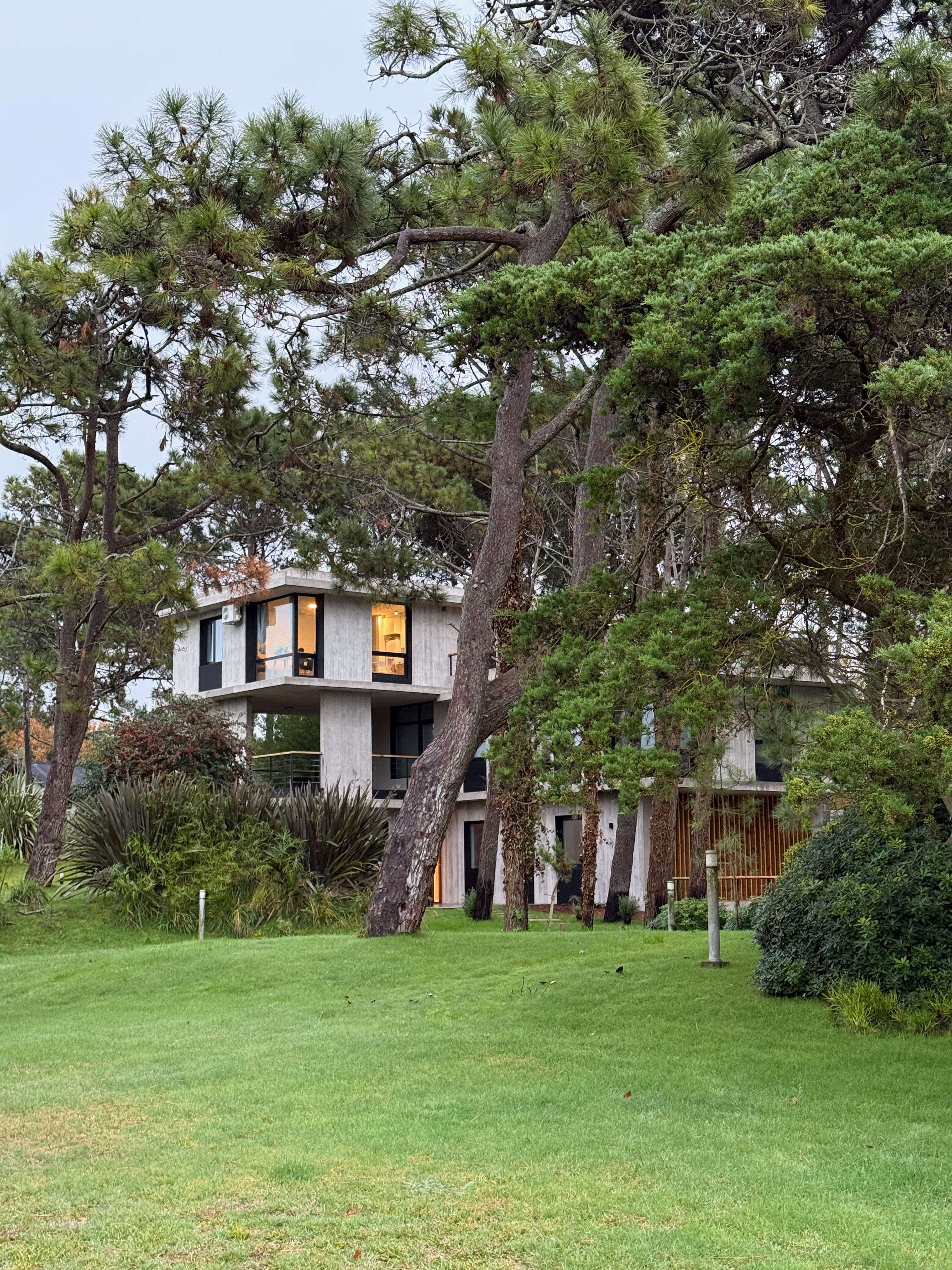 IL BUCO villa viewed from the garden with pine forest setting